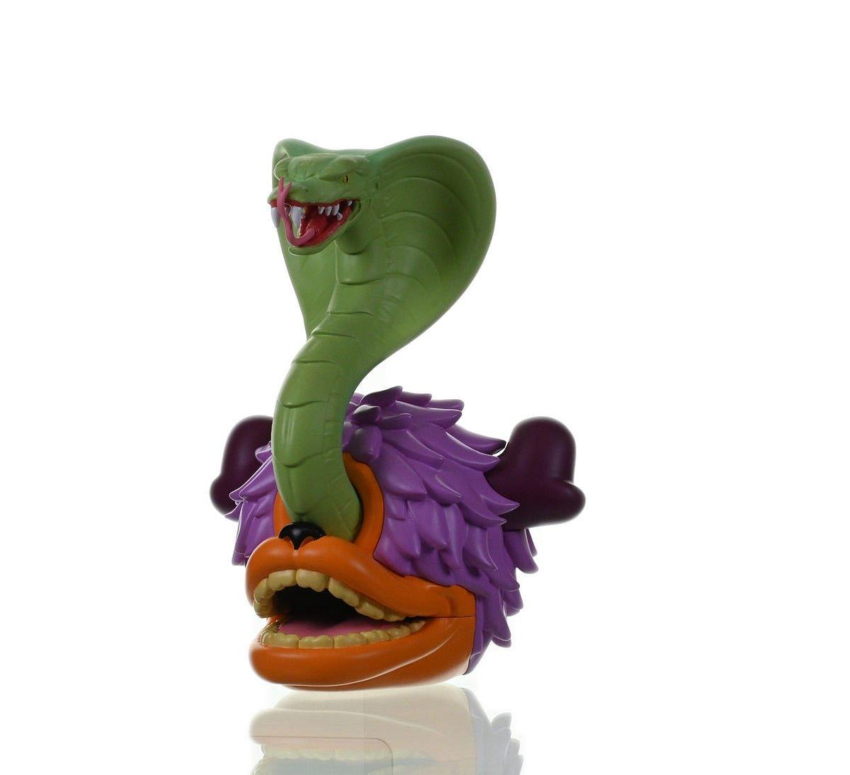 Side view of TRAVEY METAL SNAKE EYES collectible metal toy