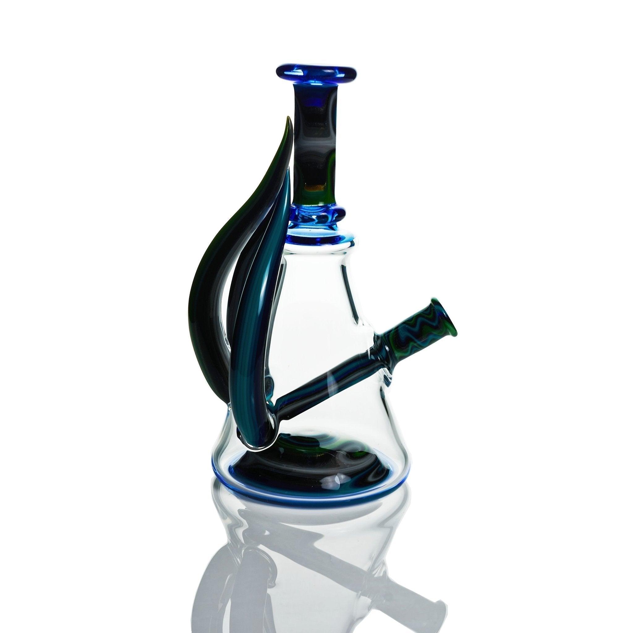 Detailed craftsmanship of Vigil Glass Rig with forest linework and blue dream accents